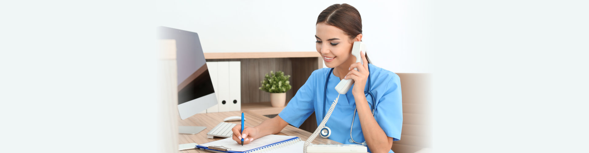 Female medical assistant at workplace in clinic